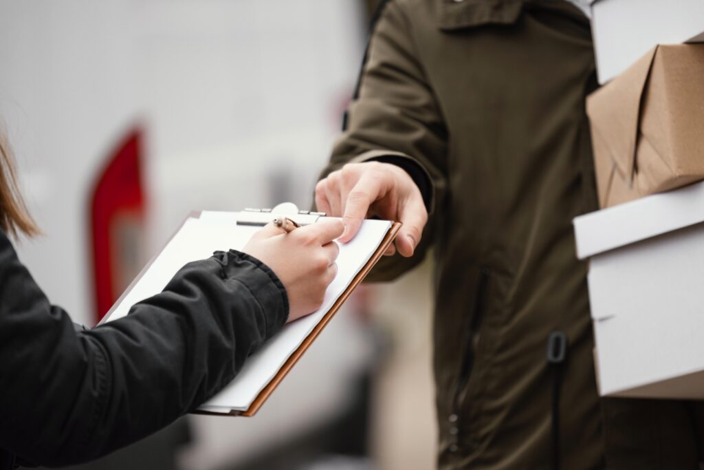 close-up-signing-package-delivery